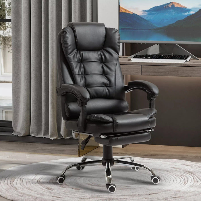 Image of a black leather executive office chair on wheels with armrests, and a retractable footrest for home office