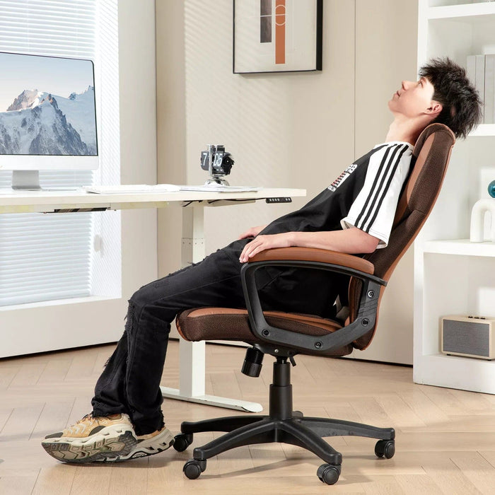 Image of a brown faux leather desk chair with wheels, arms and adjustable features.