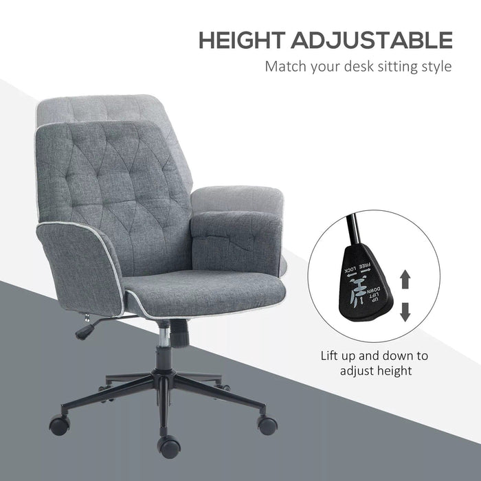 Image of a modern office desk chair upholstered in a stylish grey linen. The desk chair has a mid back with button tufting, armrests, swivel wheels, and adjustable height and backrest. This comfortable office chair is modern for yoru home office.