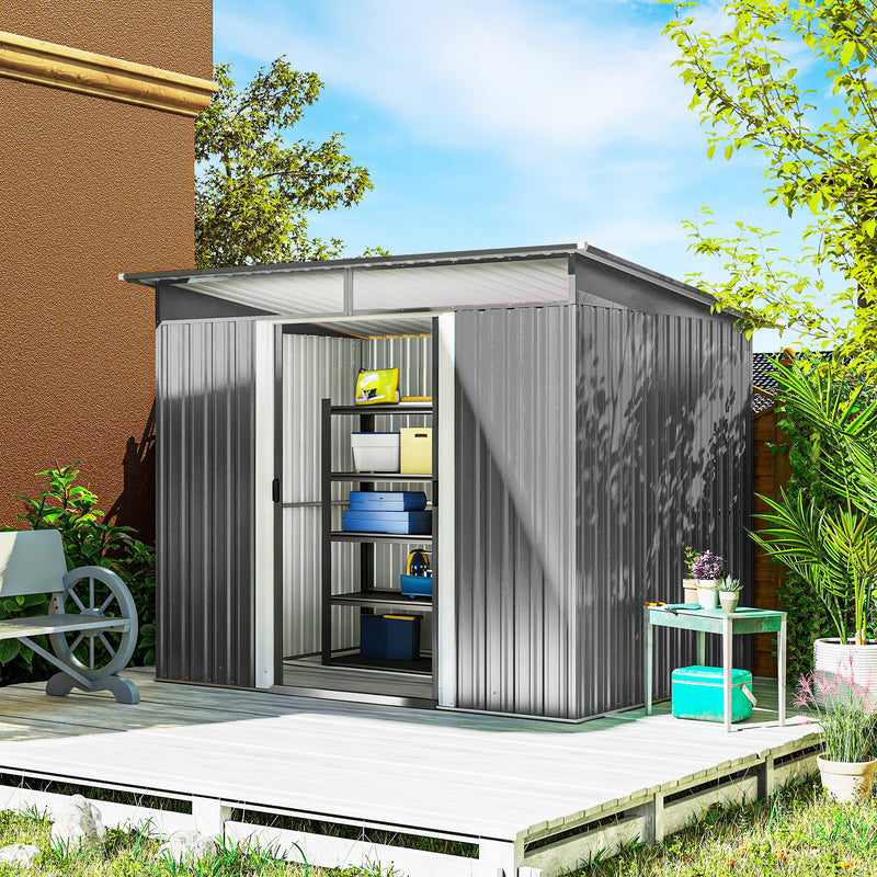 Grey metal garden storage shed with double sliding doors and windows.