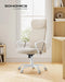 Image of a High Back Ergonomic Office Chair With Wheels and Arms. The chair is upholstered in a stylish cappuccino coloured fabric with white arms and swivel base. 
