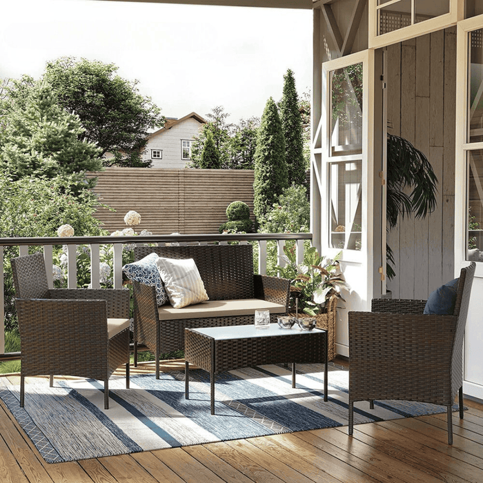 Image of a 4 Piece Brown Rattan Patio Furniture Set With Taupe Cushions