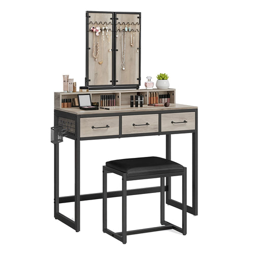 Dressing table with mirror, drawers, and stool on a white background