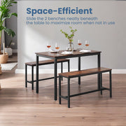 Dining table with two benches in a bright dining room with wine glasses on the table