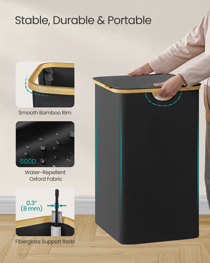 Songmics laundry basket in bedroom setting sorting clothes