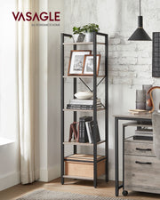 Heather greige bookcase standing beside a desk against an exposed brick wall