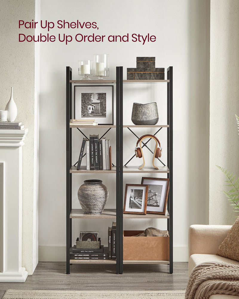 Two heather greige bookcases paired side by side in a living room alcove