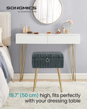 Vanity stool with the storage lid open showing the hook-and-loop dividers