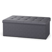 Slate grey folding storage ottoman bench, lifestyle shot in living room