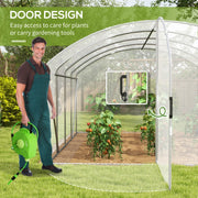 Image of a large walk in polytunnel greenhouse with a large door to the front