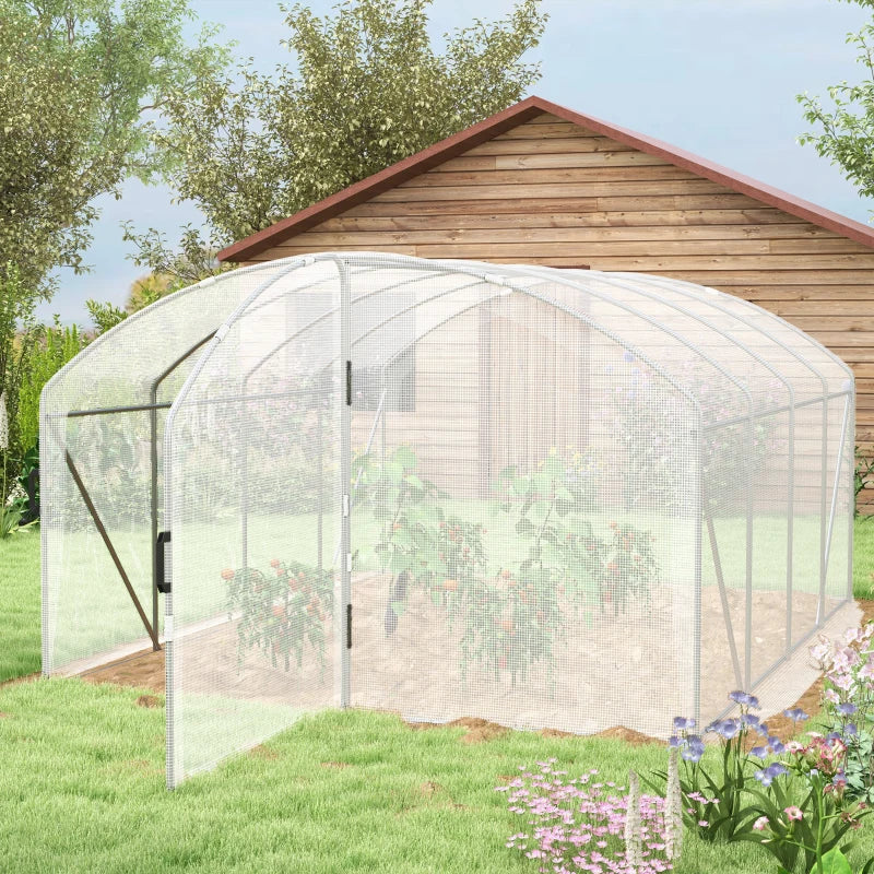 Image of a large walk in polytunnel greenhouse with a large door to the front