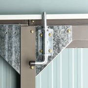 Image of a grey 8x4 metal garden shed with apex roof double doors and a window