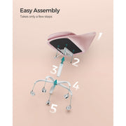 Image of a Modern Velvet Office Chair With Wheels. This is pink with white swivel wheels.