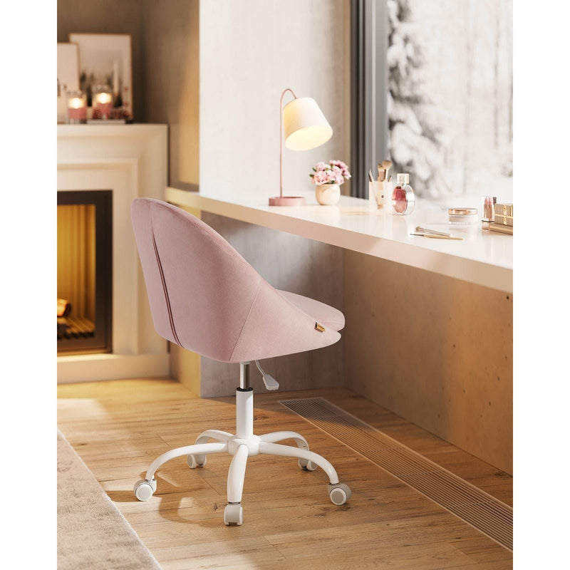 Image of a Modern Velvet Office Chair With Wheels. This is pink with white swivel wheels.