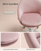 Image of a Modern Velvet Office Chair With Wheels. This is pink with white swivel wheels.