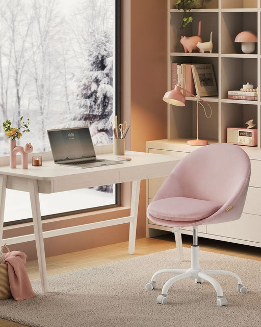 Image of a Modern Velvet Office Chair With Wheels. This is pink with white swivel wheels.