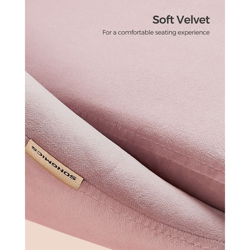 Image of a Modern Velvet Office Chair With Wheels. This is pink with white swivel wheels.