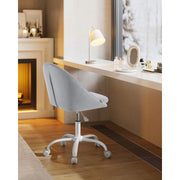 Image of a Modern Velvet Office Chair With Wheels. This is grey with white swivel wheels.