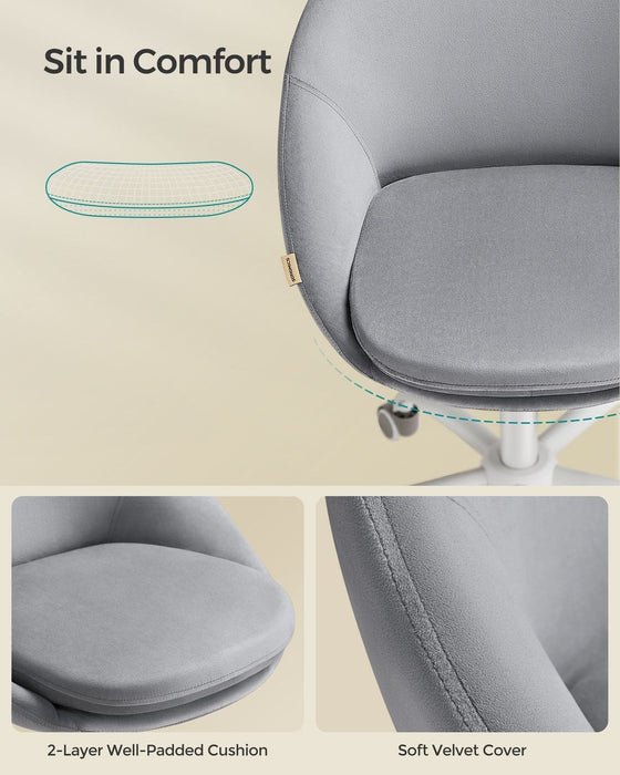 Image of a Modern Velvet Office Chair With Wheels. This is grey with white swivel wheels.