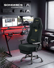 Charcoal Gray gaming chair reclined with footrest extended in a gaming desk setup