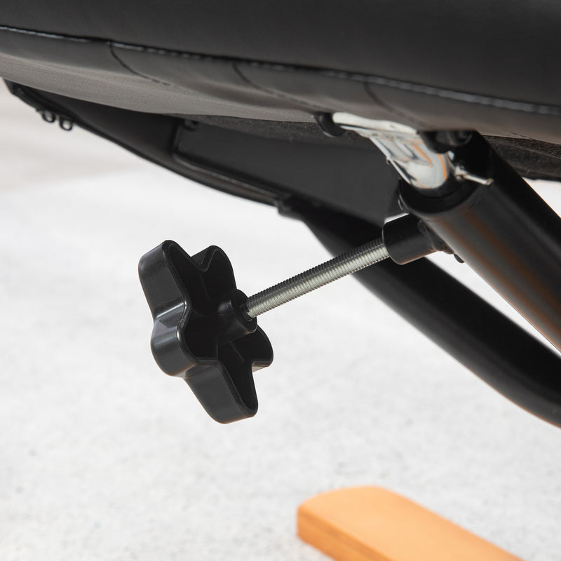 Black Faux Leather Reclining Armchair with Matching Footstool and Curved Wood Base for Living Room