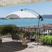 Image of a light grey Shanghai cantilever garden parasol with a cross base