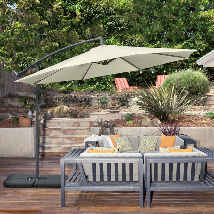 Image of a beige cantilever parasol with a weighted base