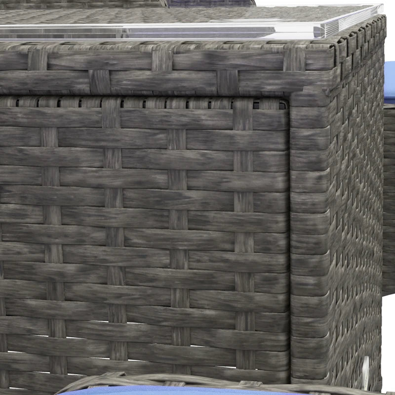 Image of a PE rattan patio bistro set for two. Image shows 2 dark grey rattan armchairs with blue cushions and matching footstools. There is also a matching rattan coffee table with a glass too.