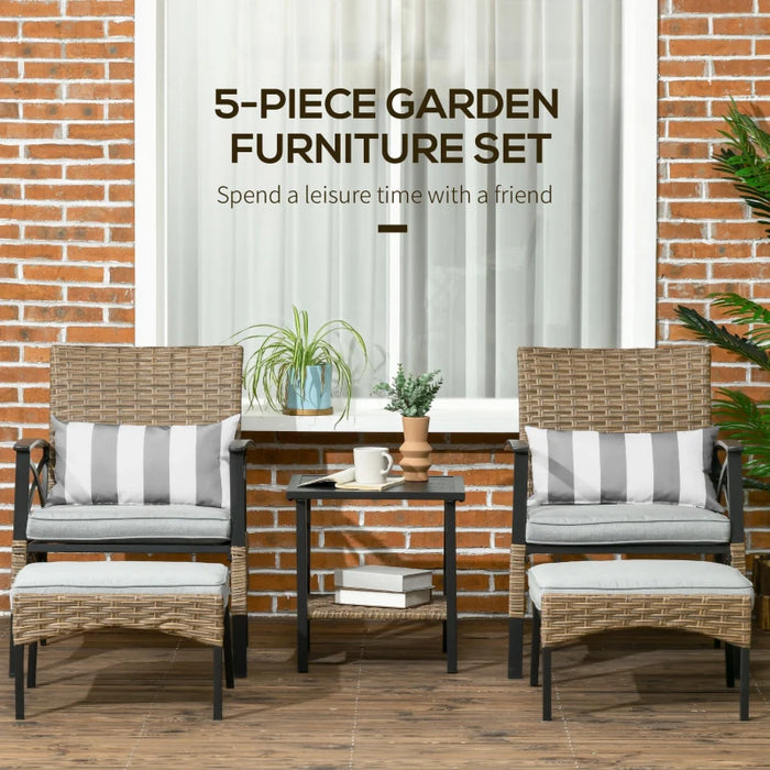 Image of a rattan patio furniture set consisting of 2 khaki coloured armchairs with grey seat cushions, 2 footstools and a coffee table with a shelf