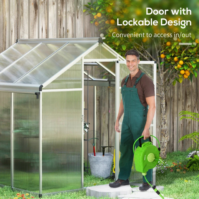 Image of an Outsunny Walk in polycarbonate greenhouse with a window on the roof and a sliding door at the front