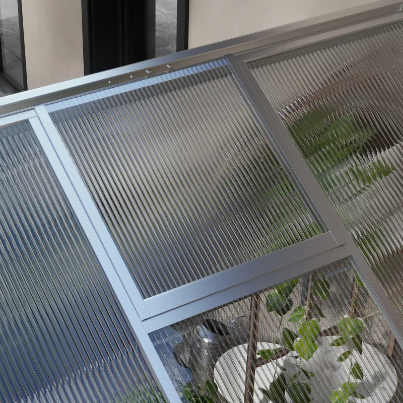 Image of an Outsunny Walk in polycarbonate greenhouse with a window on the roof and a sliding door at the front