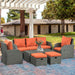 Image of an Outsunny 7 Seater Rattan Garden Furniture Set With Coffee Table Footstools and Reclining Armchairs Grey Rattan and Vibrant Orange Cushions
