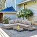 Image of a 5 Seater Grey Rattan Corner Sofa Set with Tables & Cushions on a patio