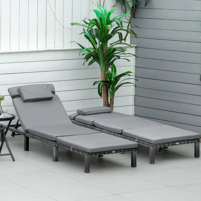 Image of a set of 2 grey rattan sun lounger with cushions and adjustable backrests