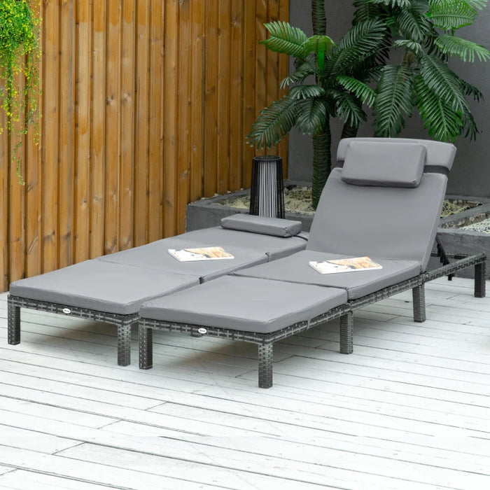 Image of a set of 2 grey rattan sun lounger with cushions and adjustable backrests