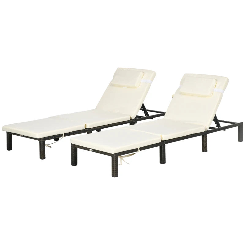 Image of a set of 2 brown rattan sun loungers with cream cushions and reclining backrests