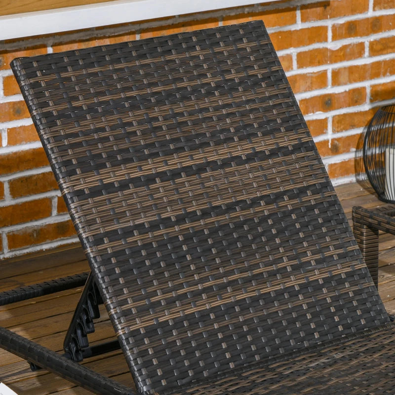 Image of a set of 2 brown rattan sun loungers with cream cushions and reclining backrests