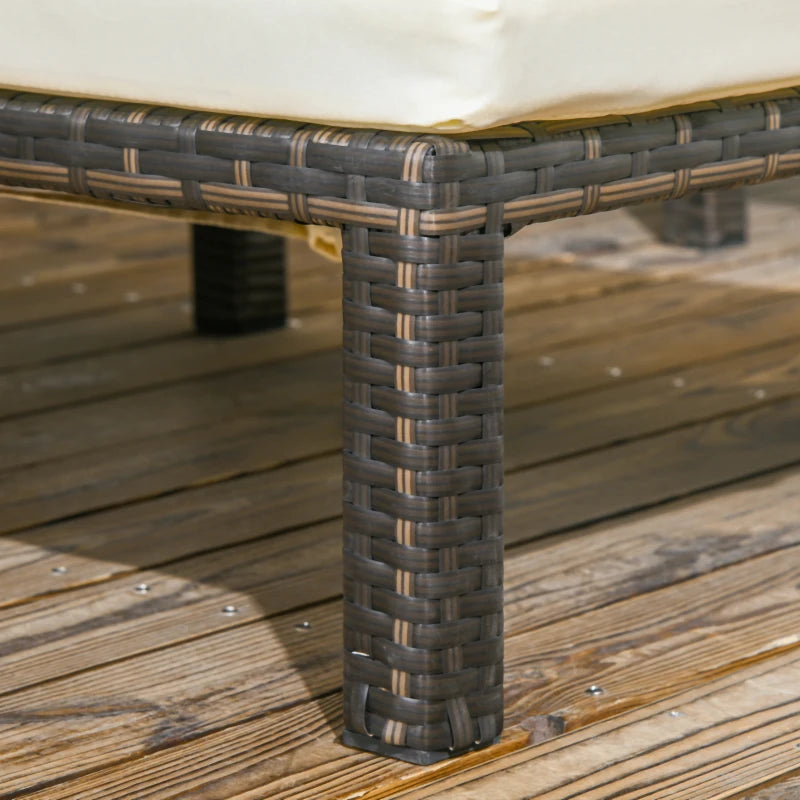 Image of a set of 2 brown rattan sun loungers with cream cushions and reclining backrests