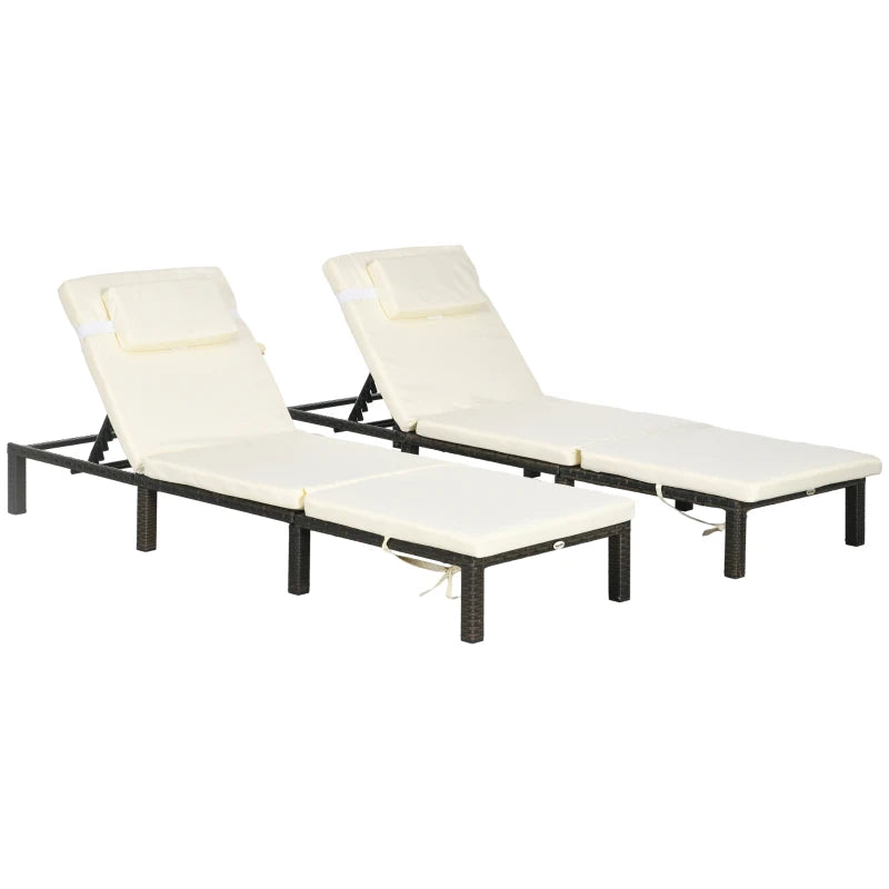 Image of a set of 2 brown rattan sun loungers with cream cushions and reclining backrests