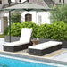 Image of a set of 2 reclining rattan sun loungers with cushions brown rattan with cream cushions