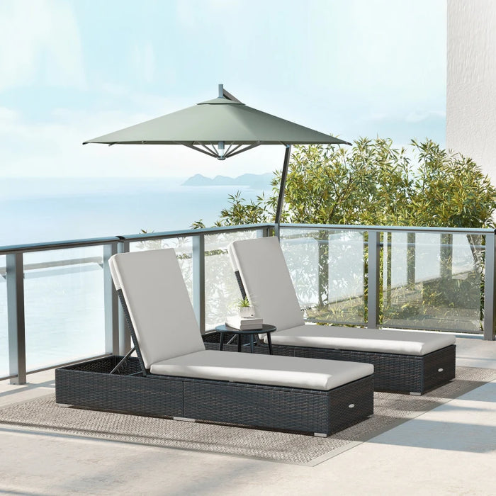 Image of a set of 2 reclining rattan sun loungers with cushions brown rattan with cream cushions