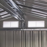 Image of a small green metal garden shed with an apex roof and single sliding door