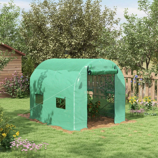 Image of a green small walk in greenhouse with windows and a roll up door