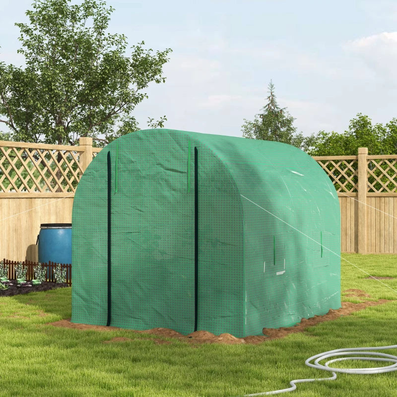 Image of a green small walk in greenhouse with windows and a roll up door