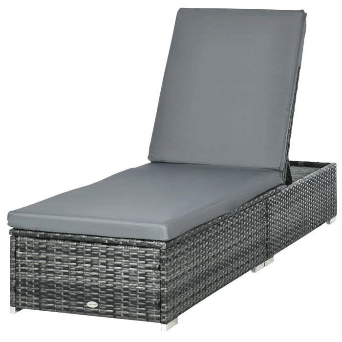 Image of a reclining rattan sun lounger with a grey cushion