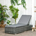 Image of a reclining rattan sun lounger with a grey cushion