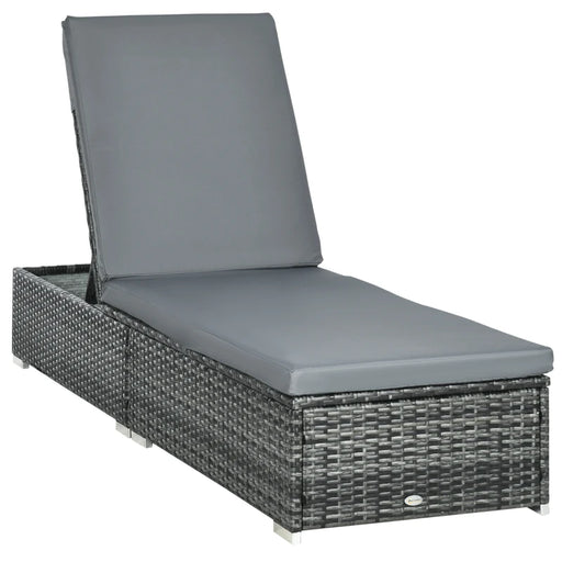 Image of a reclining rattan sun lounger with a grey cushion