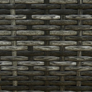 Image of a reclining rattan sun lounger with a grey cushion