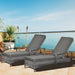 Image of a set of rattan sun loungers with cushions, wheels, and arms - Grey 