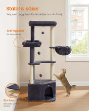 Cat playing with the hanging pompom on the tower